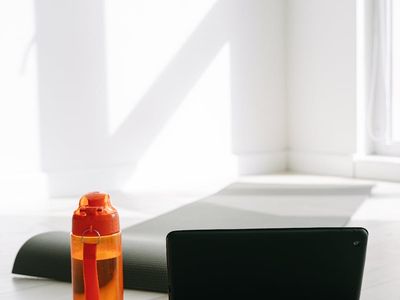 Yoga block and water bottle on a clean floor